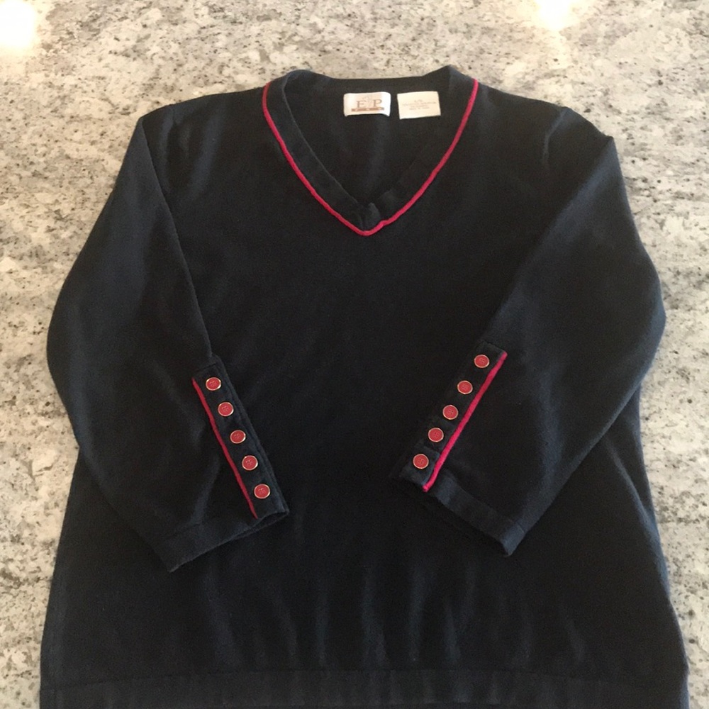 Size L black cotton top with red details.
